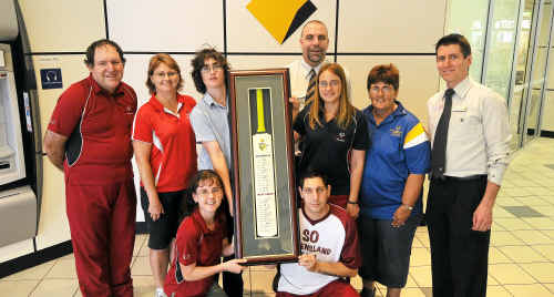 (Back) Stephen O’May, Ollie Langton, Ashlee Campbell, manager of the Commonwealth Bank Danny Weilman, Michelle Cotter, Merle King, Mark Butler, (front) Kimberley Langton and Elijah Bond with the cricket bat being raffled. Proceeds from the raffle will help Bond, Langton, Cotter and O’May meet the costs of travelling to Greece next year for the Special Olympics World Summer Games. (Back) Stephen O’May, Ollie Langton, Ashlee Campbell, manager of the Commonwealth Bank Danny Weilman, Michelle Cotter, Merle King, Mark Butler, (front) Kimberley Langton and Elijah Bond with the cricket bat being raffled. Proceeds from the raffle will help Bond, Langton, Cotter and O’May meet the costs of travelling to Greece next year for the Special Olympics World Summer Games.